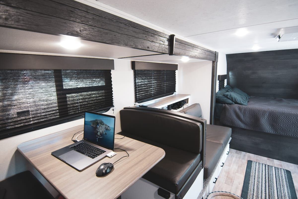Dinette used as a laptop workspace in the Houston Camper