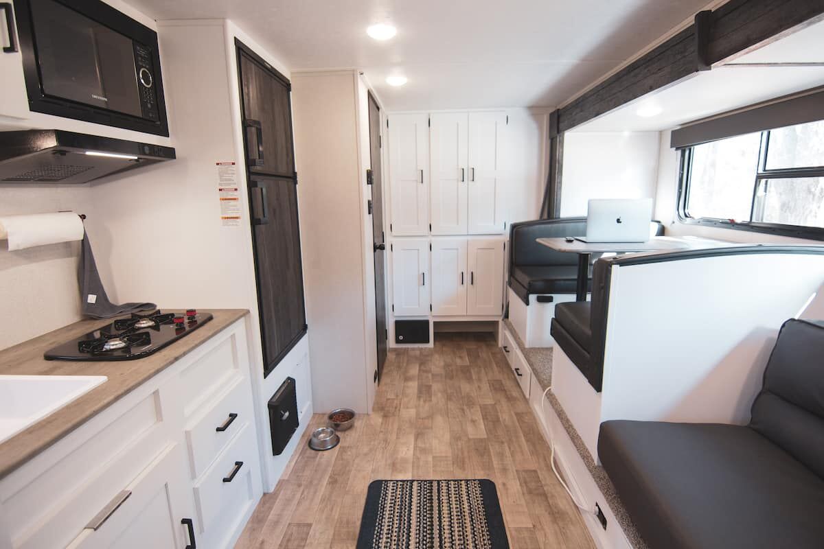 Convertible sofa with storage drawers underneath in the Houston Camper