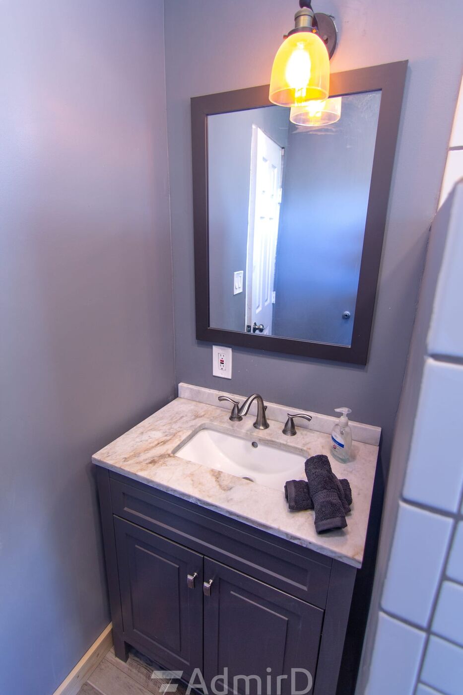Bathroom vanity with a marble-look top