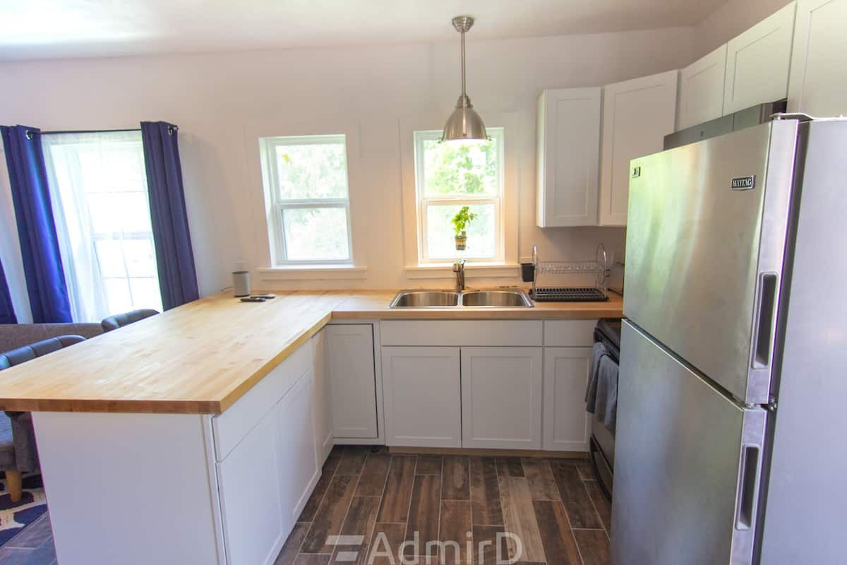 Kitchen counter and sink with white cabinets