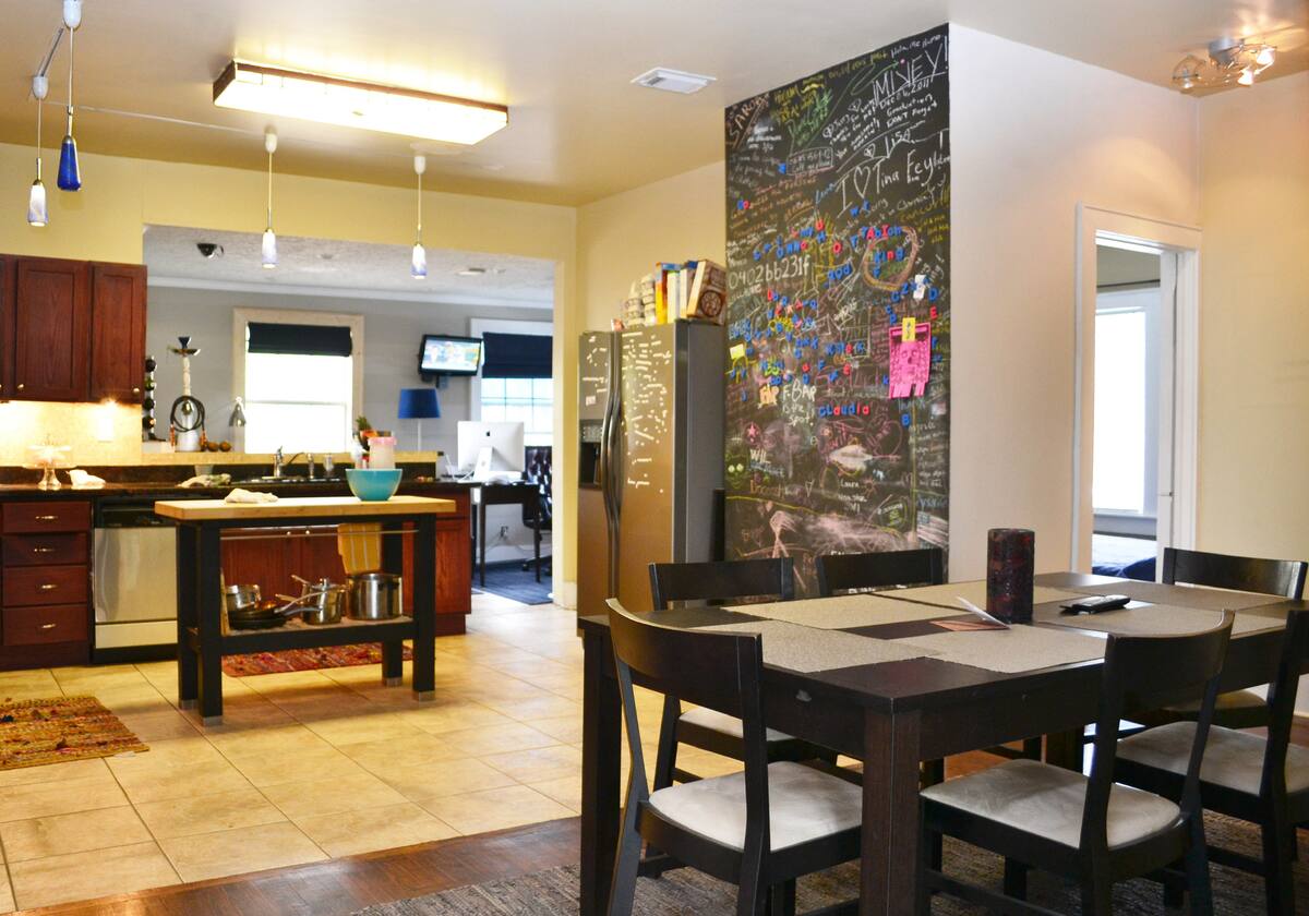 Shared kitchen and dining table in the Midtown Houston home