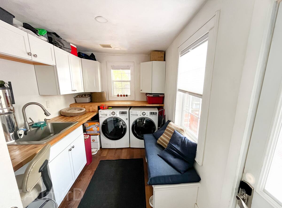 Laundry and kitchenette area with a washer and dryer