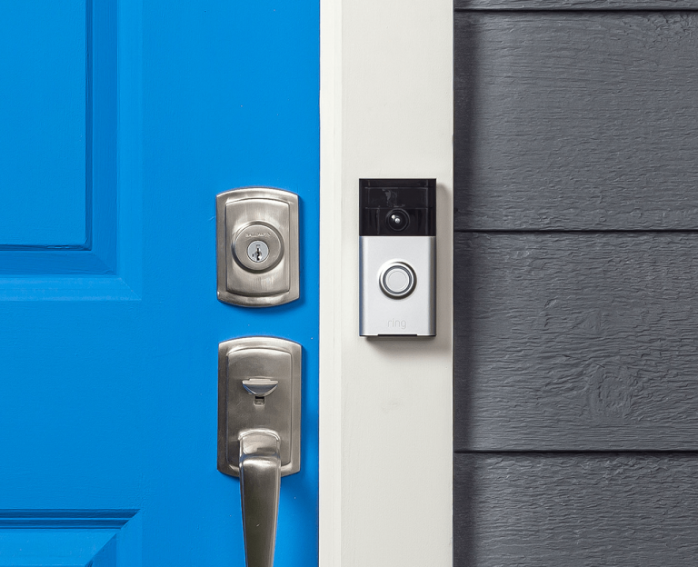 Ring video doorbell mounted beside a front door